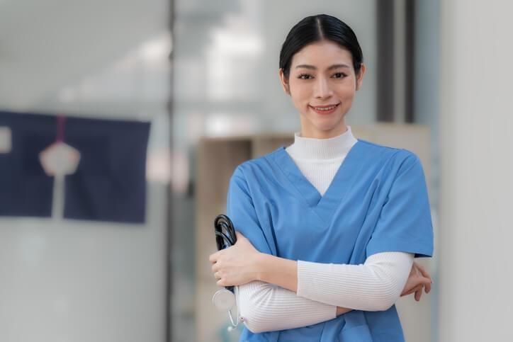 A smiling female medical office assistant at a hospital