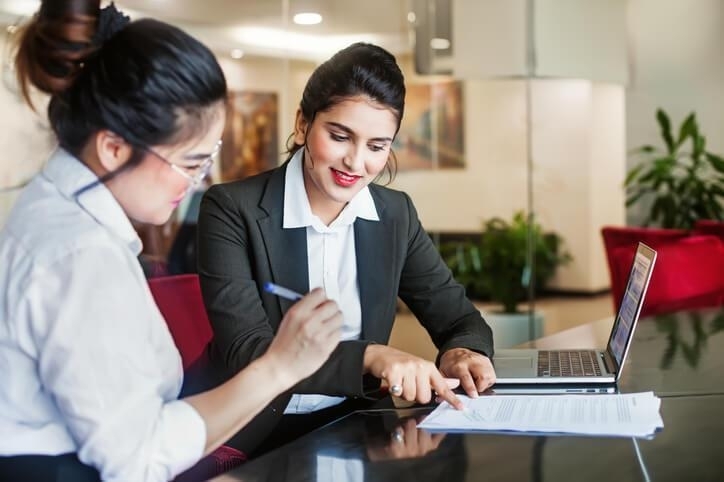 A female law clerk interacting with a client after completing her law clerk program.