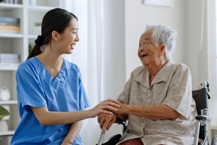 personal support worker grad caring for an elderly patient
