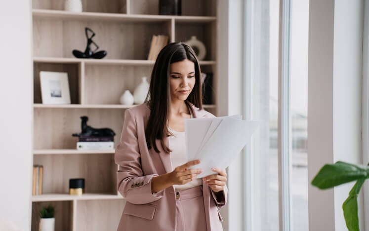 A paralegal reviewing case documents in an office