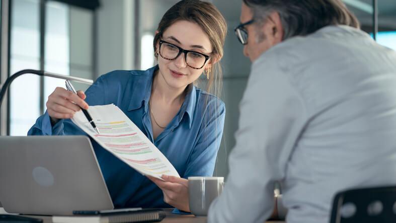 An accounting clerk helping a client