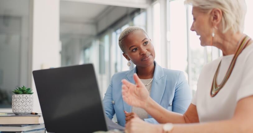 An accounting administration diploma in a meeting with a colleague