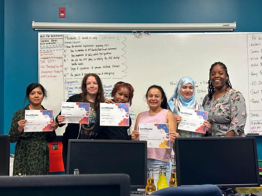 early childcare assistant with student holding their certificates