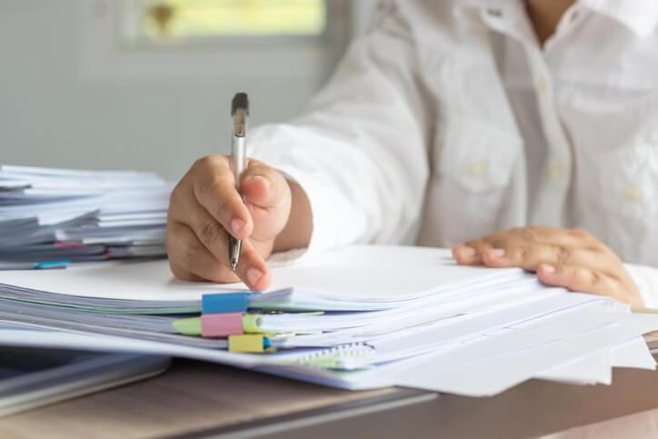 Early childcare professional completing personalized activity planning notes