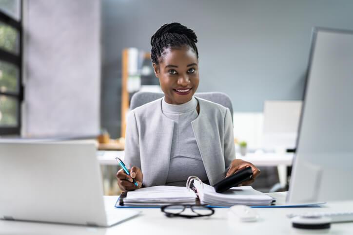 An accounting and payroll student practicing bookkeeping procedures in a training environment