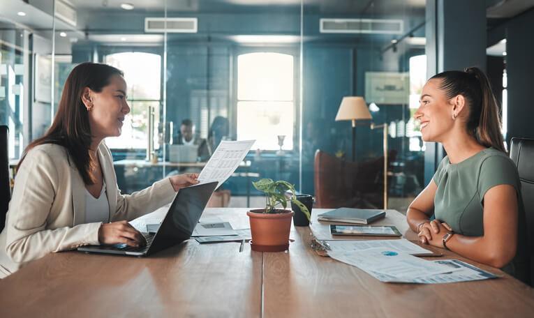 A female applicant in an interview with a female employer after business management training