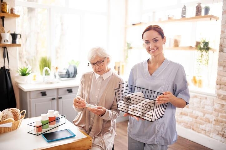 A PSW helping with daily living tasks in care facility