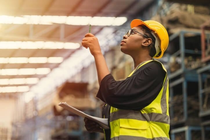 A supply chain and logistics training grad working in a warehouse